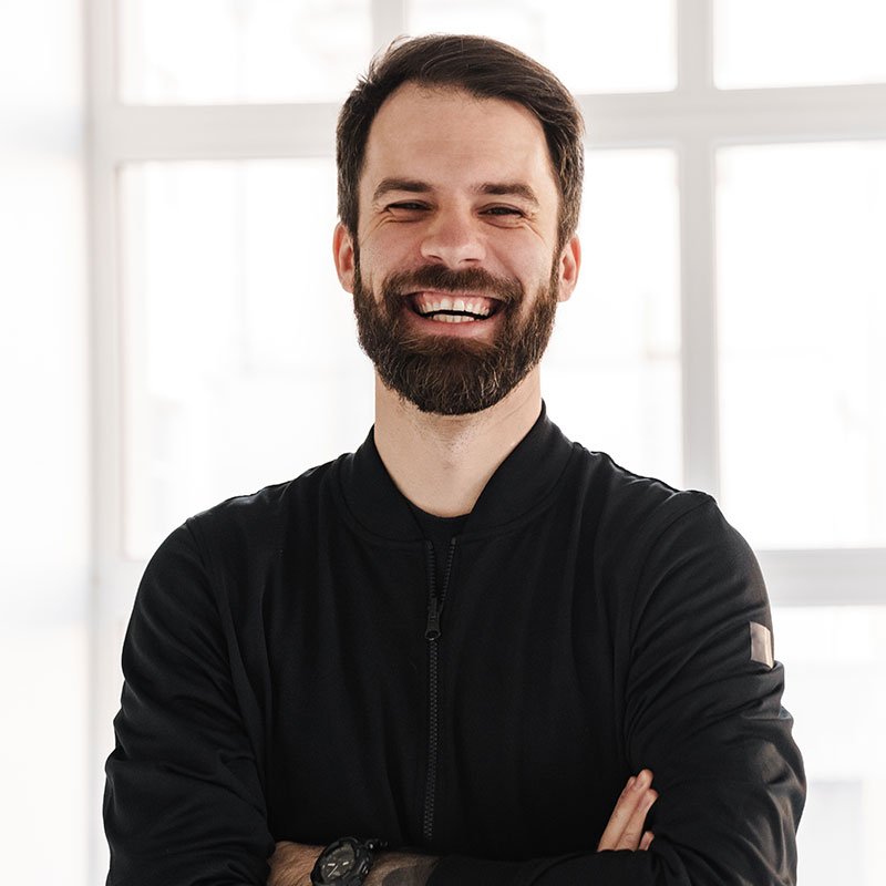 Smiling young brunette white man in sportswear 1 1.jpg